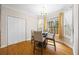 Bright breakfast nook with a glass top table, hardwood floors, and window views at 130 Brookridge Ct, Fayetteville, GA 30215