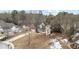 Attractive two-story red brick home surrounded by a yard with mature trees at 130 Brookridge Ct, Fayetteville, GA 30215