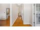 Inviting hallway with hardwood floors, leading to various rooms in the home at 130 Brookridge Ct, Fayetteville, GA 30215