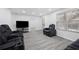 Cozy living room area with modern finishes, comfortable seating, and a view of the community at 130 Brookridge Ct, Fayetteville, GA 30215
