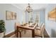 Light and airy dining room featuring a modern chandelier and french doors to the backyard at 2184 Clairmont Ne Ter, Atlanta, GA 30345