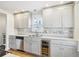 Well-lit kitchen featuring modern appliances, white cabinets, and stylish tile backsplash at 2184 Clairmont Ne Ter, Atlanta, GA 30345