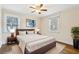 Inviting main bedroom with a king-size bed, two windows, and wood floors at 2184 Clairmont Ne Ter, Atlanta, GA 30345