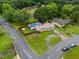 An aerial view shows a neighborhood home with a pool, deck, and large, fenced-in yard at 2818 Kensington Way, Rex, GA 30273