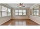 Bright sunroom with hardwood floors, crown molding, and plenty of natural light at 4340 Bluejay Pl, Cumming, GA 30041