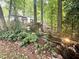 Backyard water feature and statue with lush greenery and trees at 525 S Lost Lake Cv, Villa Rica, GA 30180