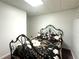 Bedroom with accent bedding and an iron bed frame at 525 S Lost Lake Cv, Villa Rica, GA 30180