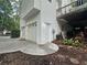 Rear view of the house featuring a three-car garage and driveway at 525 S Lost Lake Cv, Villa Rica, GA 30180