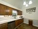 Clean kitchen with wood cabinets, stainless steel appliances, and natural lighting at 525 S Lost Lake Cv, Villa Rica, GA 30180