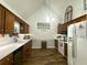 Traditional kitchen with wood cabinets, white countertops, and stainless steel appliances at 525 S Lost Lake Cv, Villa Rica, GA 30180