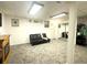 Finished basement area with decorative fireplace and full mirrored wall at 525 S Lost Lake Cv, Villa Rica, GA 30180
