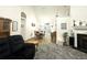Bright living room featuring vaulted ceilings, wood floors, fireplace and neutral decor at 525 S Lost Lake Cv, Villa Rica, GA 30180
