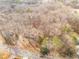 Aerial view of a wooded property with mature trees surrounding a home at 270 Cochran Ridge Rd, Dallas, GA 30157