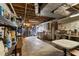 Unfinished basement featuring concrete floors, exposed ductwork, and shelving for storage space at 270 Cochran Ridge Rd, Dallas, GA 30157