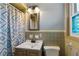 A full bathroom with unique tilework and a patterned shower curtain at 270 Cochran Ridge Rd, Dallas, GA 30157
