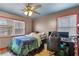A brightly lit bedroom with a large window, wood floors, and unique decor at 270 Cochran Ridge Rd, Dallas, GA 30157