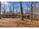 A single story brick home with a large front yard and mature trees at 270 Cochran Ridge Rd, Dallas, GA 30157