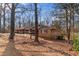 Traditional brick home with a front yard full of mature trees and foliage at 270 Cochran Ridge Rd, Dallas, GA 30157