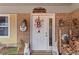 Charming brick home entrance with welcome sign and dog statues at 270 Cochran Ridge Rd, Dallas, GA 30157