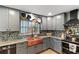 Updated kitchen featuring stainless steel appliances, custom cabinets, and copper farmhouse sink at 270 Cochran Ridge Rd, Dallas, GA 30157
