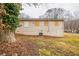 View of the backyard with foliage and a view of the rear of the house at 285 Argus Nw Cir, Atlanta, GA 30331