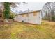 Image of the backyard with foliage and a view of the rear of the house at 285 Argus Nw Cir, Atlanta, GA 30331