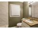This bathroom features neutral walls, updated white tile on the walls and a granite sink at 285 Argus Nw Cir, Atlanta, GA 30331