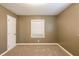 This bedroom features neutral walls, carpet floors and a window to let in natural light at 285 Argus Nw Cir, Atlanta, GA 30331