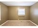 This bedroom features neutral walls, carpet floors and a window to let in natural light at 285 Argus Nw Cir, Atlanta, GA 30331