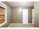 This bedroom features neutral walls, carpet floors, and two white doors at 285 Argus Nw Cir, Atlanta, GA 30331