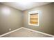 This bedroom features neutral walls, carpet floors and a covered window to let in natural light at 285 Argus Nw Cir, Atlanta, GA 30331