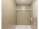 This walk-in closet features neutral walls, tile floor, and a metal shelf at 285 Argus Nw Cir, Atlanta, GA 30331