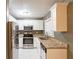 Modern kitchen featuring stainless steel appliances, granite countertops, and white cabinetry at 285 Argus Nw Cir, Atlanta, GA 30331