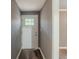 A welcoming entryway with a modern front door and hardwood floors at 3111 Flat Shoals Rd, Decatur, GA 30034