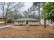 Charming single-story home with a brick facade and a well-maintained front yard at 3111 Flat Shoals Rd, Decatur, GA 30034