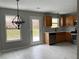 Modern eat-in kitchen with stainless steel appliances, ample natural light, and backyard access at 4976 Notting Glen Ln, Snellville, GA 30039