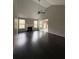 Open living room with hardwood floors, a fireplace, and large windows offering ample sunlight at 4976 Notting Glen Ln, Snellville, GA 30039