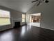 Bright living room flowing into the kitchen, featuring hardwood floors and natural light at 4976 Notting Glen Ln, Snellville, GA 30039
