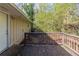 Wooden deck off the back of the house offers a private outdoor space with views of surrounding trees and greenery at 2958 Flat Shoals Rd, Decatur, GA 30034