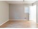 Bedroom features wood-look floors, ceiling fan, and a window at 2958 Flat Shoals Rd, Decatur, GA 30034