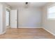 Bedroom features wood-look floors and a window at 2958 Flat Shoals Rd, Decatur, GA 30034