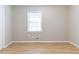 Neutral bedroom features wood-look floors and a window at 2958 Flat Shoals Rd, Decatur, GA 30034