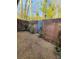 Private backyard features pea gravel, brick walls, and minimal landscaping, offering a tranquil outdoor space at 3260 Henderson Mill Rd # A, Atlanta, GA 30341