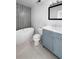 Bathroom featuring grey tile wall, soaking tub, and vanity with sink at 3260 Henderson Mill Rd # A, Atlanta, GA 30341