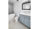 Bathroom featuring grey tile wall, soaking tub, and vanity with sink at 3260 Henderson Mill Rd # A, Atlanta, GA 30341