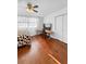 Hardwood floors, natural light, and a ceiling fan accentuate this bedroom space at 3260 Henderson Mill Rd # A, Atlanta, GA 30341