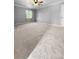 Spacious bedroom featuring neutral carpet, paint, ceiling fan, and natural light at 3260 Henderson Mill Rd # A, Atlanta, GA 30341