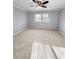 Spacious bedroom with neutral-colored walls, carpet, ceiling fan, and a window at 3260 Henderson Mill Rd # A, Atlanta, GA 30341