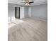 Spacious bedroom with neutral-colored walls, carpet, ceiling fan, and two doors at 3260 Henderson Mill Rd # A, Atlanta, GA 30341
