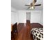 Bedroom features hardwood floors, ceiling fan, neutral paint, and closet at 3260 Henderson Mill Rd # A, Atlanta, GA 30341